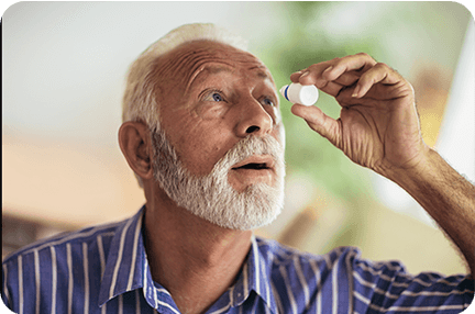 Man applying eyedrops